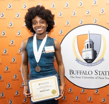 Makhia Laster with award